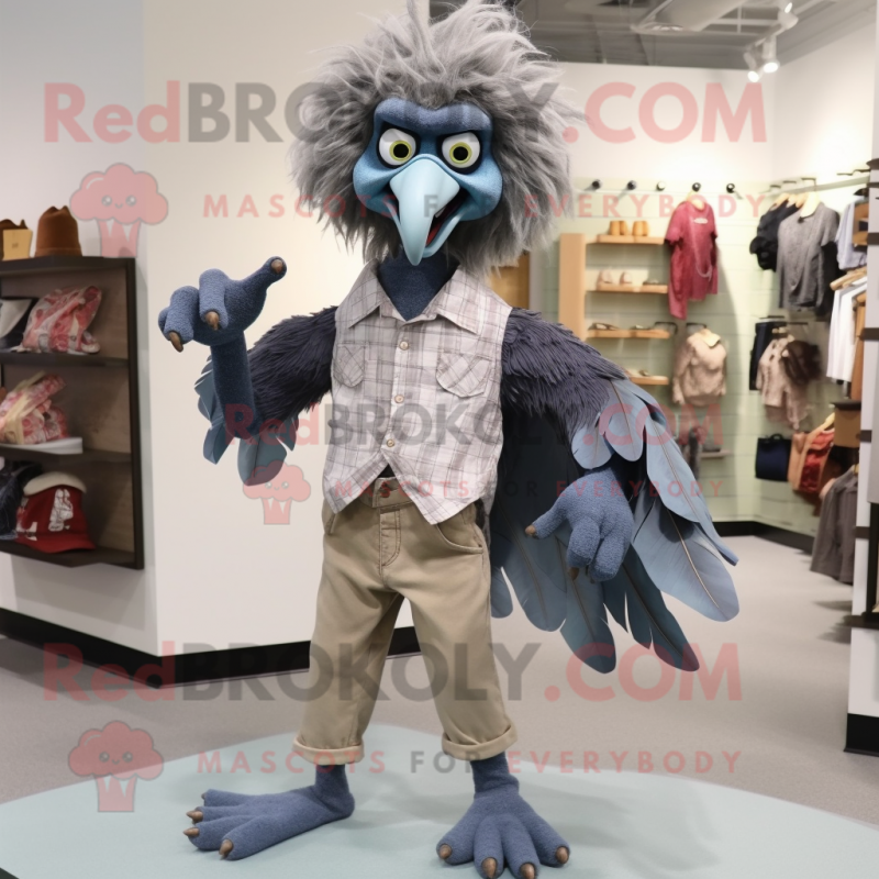 Gray Harpy mascot costume character dressed with a Chambray Shirt and Shoe clips Gray Harpy mascot costume character dressed with a Chambray Shirt and Shoe clips