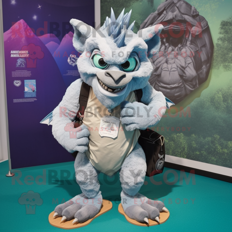 Silver Gargoyle mascot costume character dressed with a Bermuda Shorts and Backpacks Silver Gargoyle mascot costume character dressed with a Bermuda Shorts and Backpacks