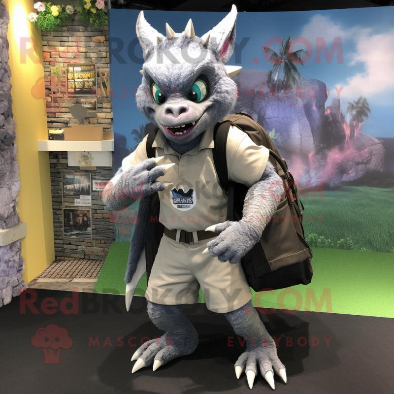 Silver Gargoyle mascot costume character dressed with a Bermuda Shorts and Backpacks Silver Gargoyle mascot costume character dressed with a Bermuda Shorts and Backpacks