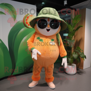 Peach Kiwi mascot costume character dressed with a Jumpsuit and Sunglasses