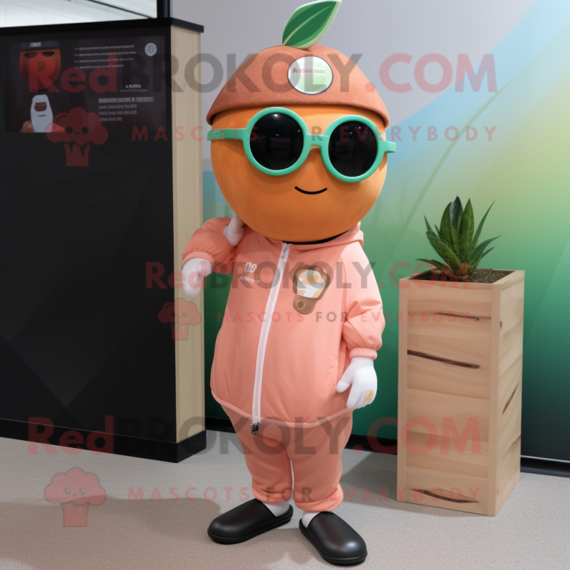 Peach Kiwi mascot costume character dressed with a Jumpsuit and Sunglasses