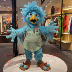 Turquoise Harpy mascot costume character dressed with a Denim Shorts and Brooches