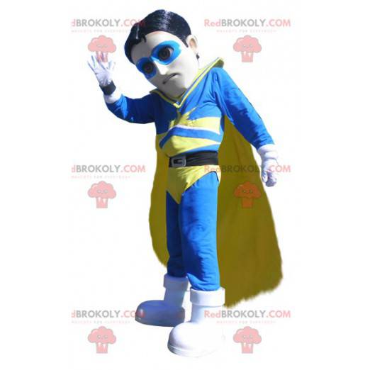 Mascota de vigilante de superhéroe en traje azul y amarillo -