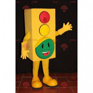 Mascota del semáforo amarillo con la cabeza en el verde -