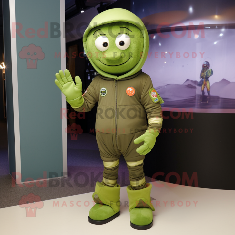 Olive Astronaut mascot costume character dressed with a Playsuit and Shoe laces