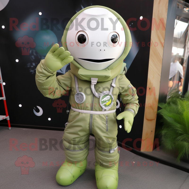 Olive Astronaut mascot costume character dressed with a Playsuit and Shoe laces