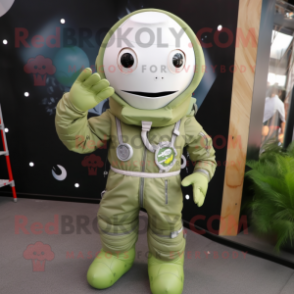 Olive Astronaut mascot costume character dressed with a Playsuit and Shoe laces