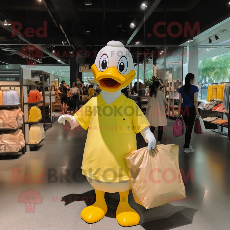 Lemon Yellow Geese mascot costume character dressed with a V-Neck Tee and Tote bags