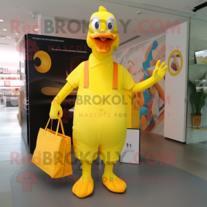 Lemon Yellow Geese mascot costume character dressed with a V-Neck Tee and Tote bags