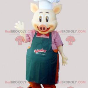 Kucharz maskotka świnia z fartuchem i kapeluszem szefa kuchni -