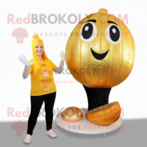 Gold Melon mascot costume character dressed with a Yoga Pants and Foot pads