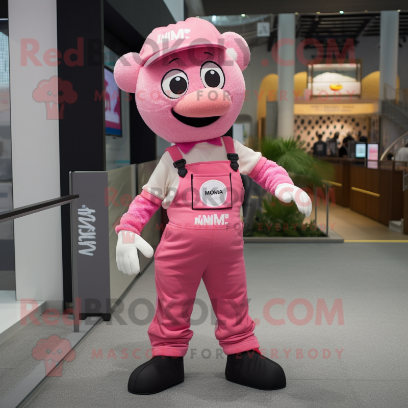 Pink Momentum mascot costume character dressed with a Overalls and Suspenders Pink Momentum mascot costume character dressed with a Overalls and Suspenders