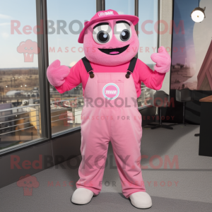 Pink Momentum mascot costume character dressed with a Overalls and Suspenders