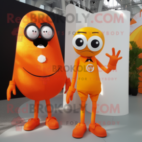 Orange Cyclops mascot costume character dressed with a Midi Dress and Ties