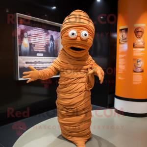 Orange Mummy mascot costume character dressed with a Pleated Skirt and Hats