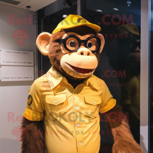 Gold Chimpanzee mascot costume character dressed with a Oxford Shirt and Eyeglasses