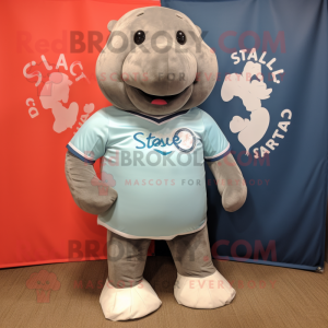 Gray Stellar'S Sea Cow mascot costume character dressed with a Rugby Shirt and Shoe clips