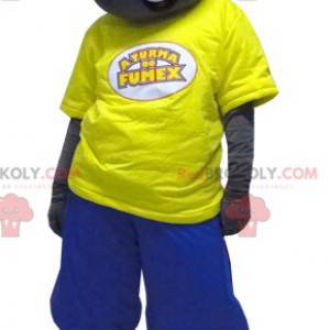 Mascotte de garçon noir habillé en jaune et bleu -