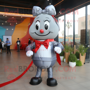 Silver Shakshuka mascot costume character dressed with a Jeggings and Bow ties