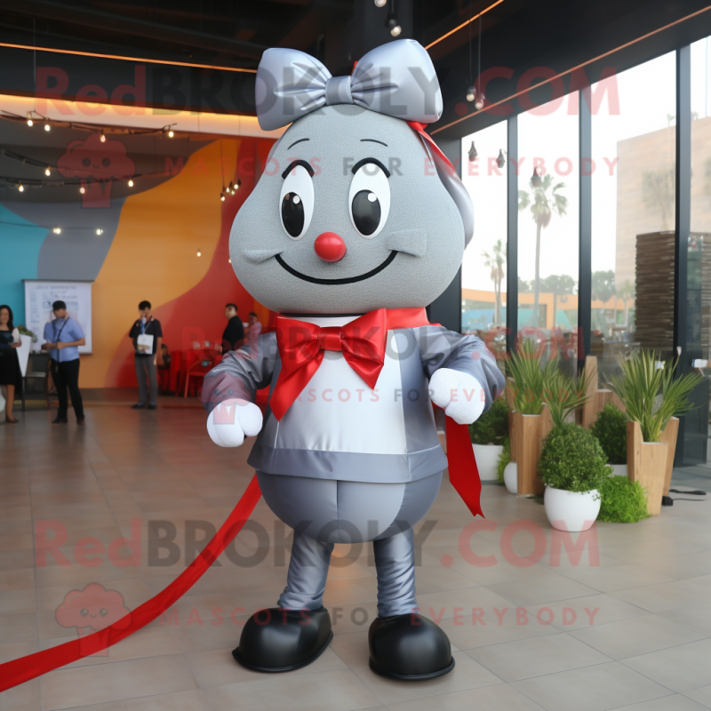 Silver Shakshuka mascot costume character dressed with a Jeggings and Bow ties Silver Shakshuka mascot costume character dressed with a Jeggings and Bow ties