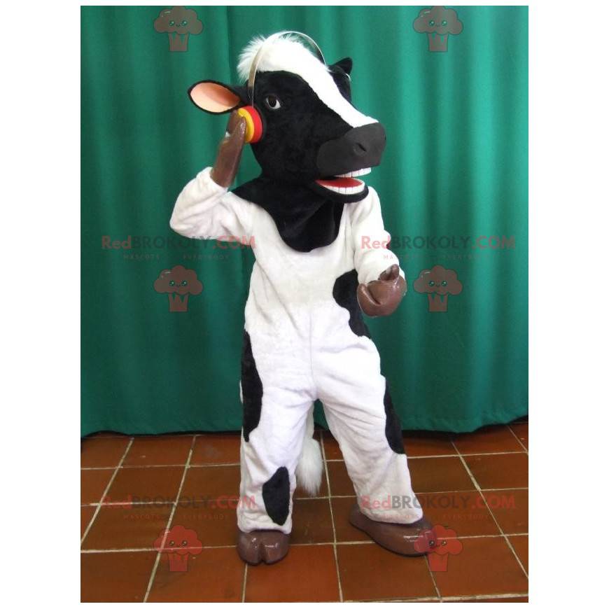 Mascote de vaca preto e branco com fones de ouvido -