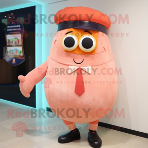 Peach Cyclops mascot costume character dressed with a Cardigan and Berets