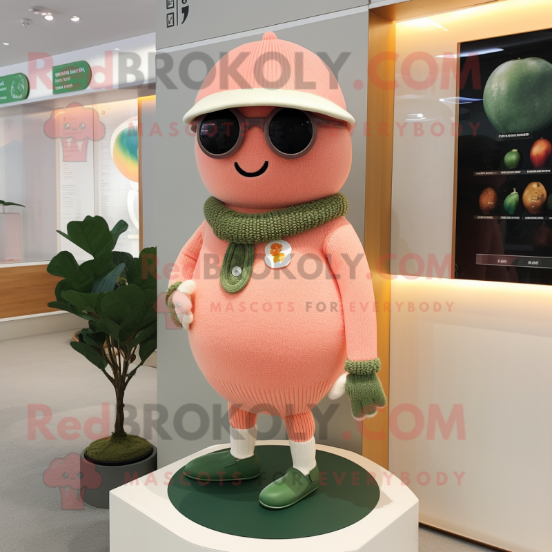 Peach Cyclops mascot costume character dressed with a Cardigan and Berets Peach Cyclops mascot costume character dressed with a Cardigan and Berets