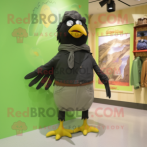 Olive Blackbird mascot costume character dressed with a Bermuda Shorts and Scarves