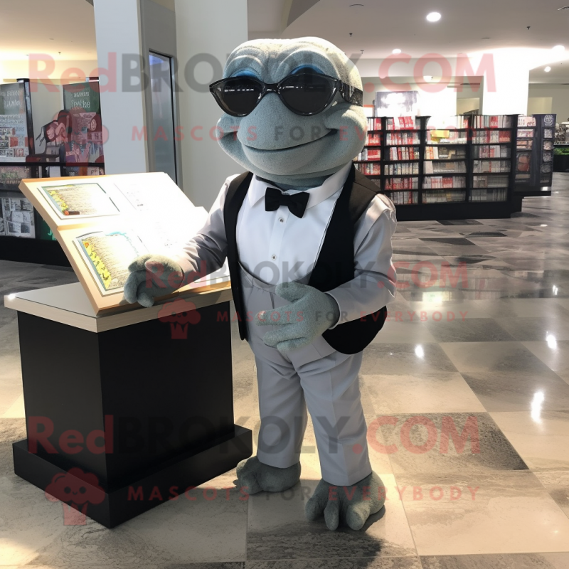 Silver Sea Turtle mascot costume character dressed with a Tuxedo and Reading glasses