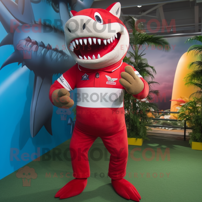 Red Shark mascot costume character dressed with a Rugby Shirt and Wraps