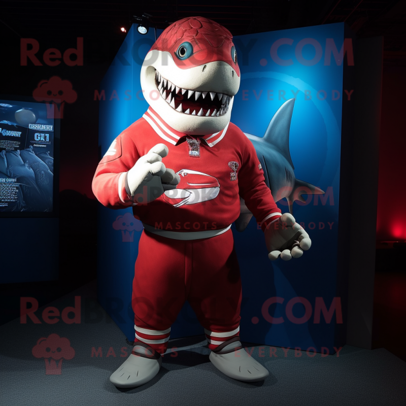 Red Shark mascot costume character dressed with a Rugby Shirt and Wraps Red Shark mascot costume character dressed with a Rugby Shirt and Wraps