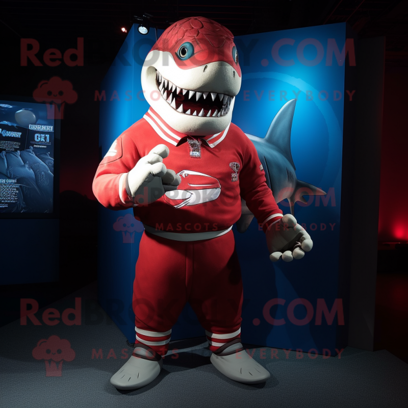 Red Shark mascot costume character dressed with a Rugby Shirt and Wraps