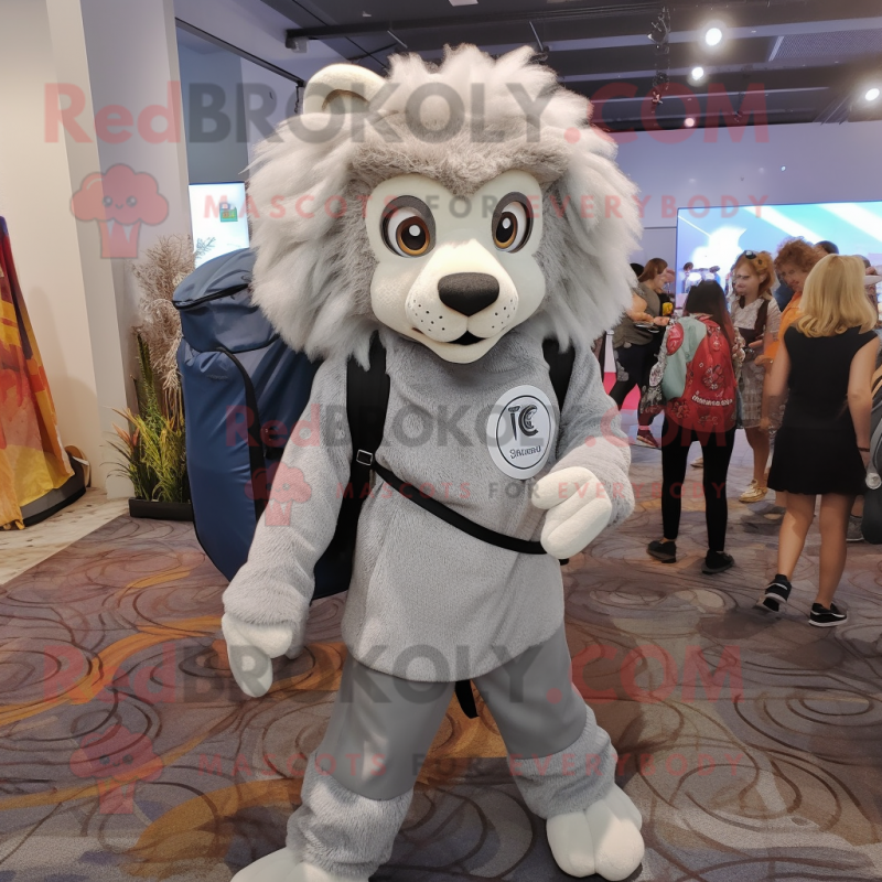 Silver Tamer Lion mascot costume character dressed with a Shift Dress and Backpacks