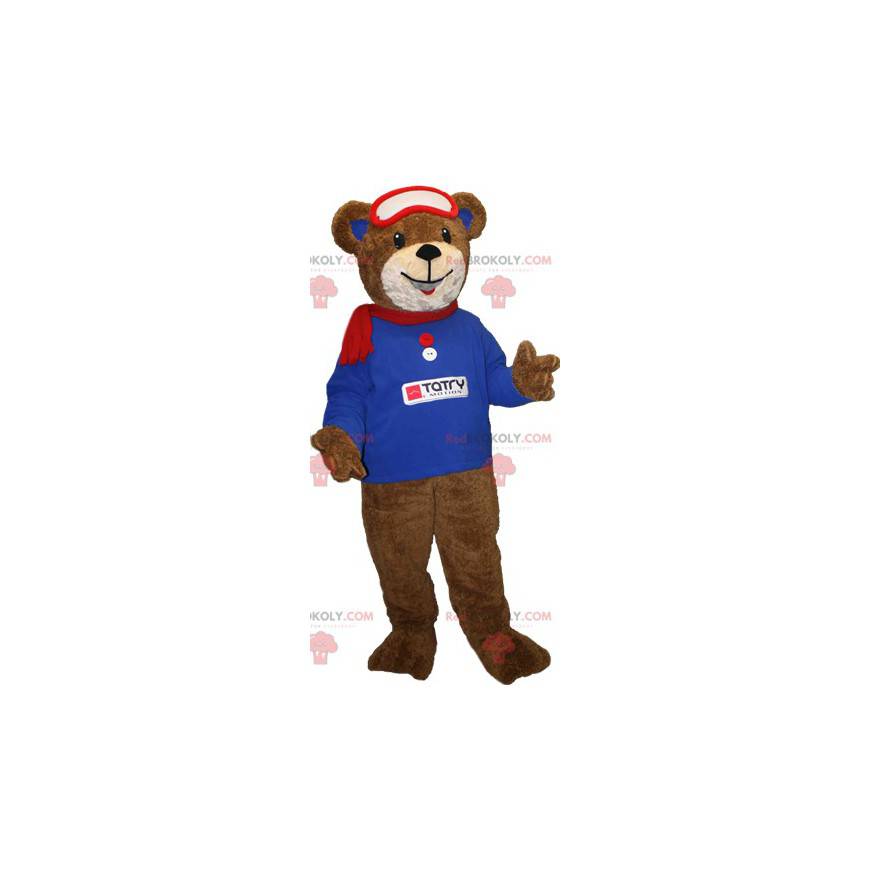 Brown bear mascot with a blue sweatshirt and a scarf -