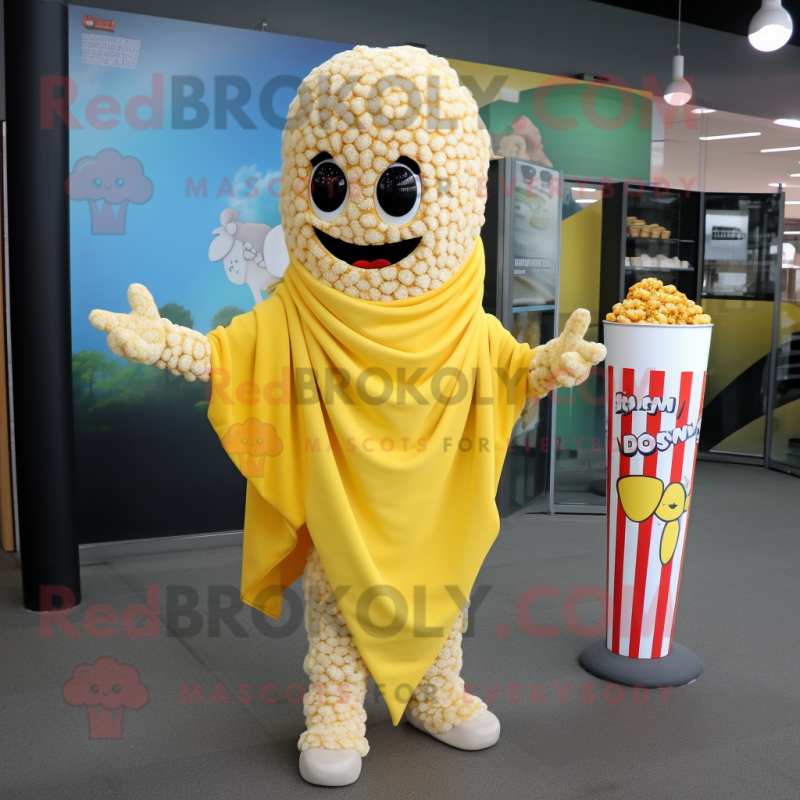 Yellow Pop Corn mascot costume character dressed with a Cover-up and Scarf clips Yellow Pop Corn mascot costume character dressed with a Cover-up and Scarf clips