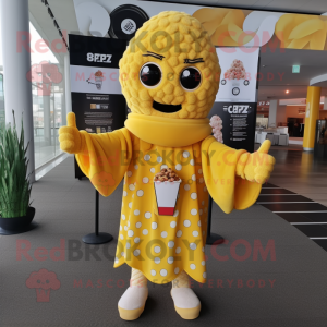 Yellow Pop Corn mascot costume character dressed with a Cover-up and Scarf clips