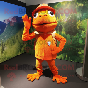 Orange Frog mascot costume character dressed with a Cardigan and Caps