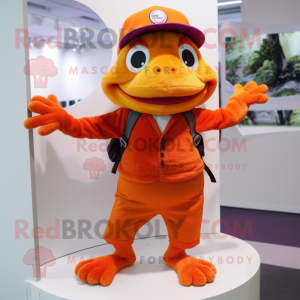 Orange Frog mascot costume character dressed with a Cardigan and Caps