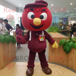Maroon Apple mascot costume character dressed with a Corduroy Pants and Brooches