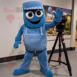 Blue Camera mascot costume character dressed with a Overalls and Tie pins