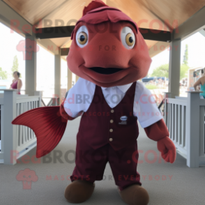 Maroon Goldfish mascot costume character dressed with a Poplin Shirt and Suspenders