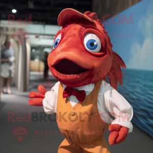 Maroon Goldfish mascot costume character dressed with a Poplin Shirt and Suspenders