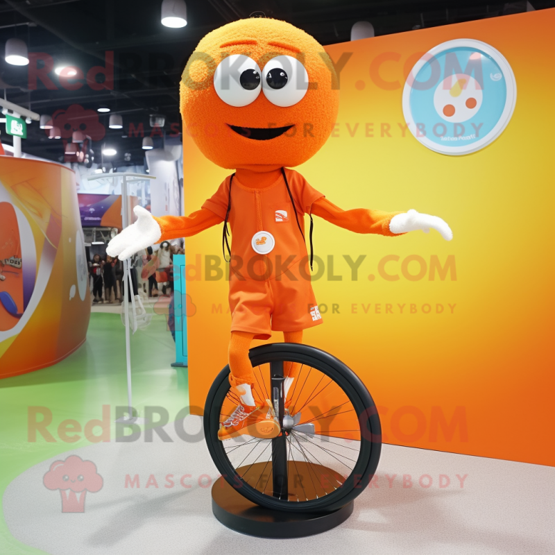 Orange Unicyclist mascot costume character dressed with a Shorts and Shawl pins