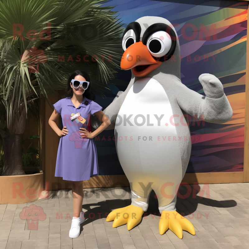 Silver Toucan mascot costume character dressed with a Shift Dress and Sunglasses