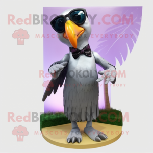 Silver Toucan mascot costume character dressed with a Shift Dress and Sunglasses