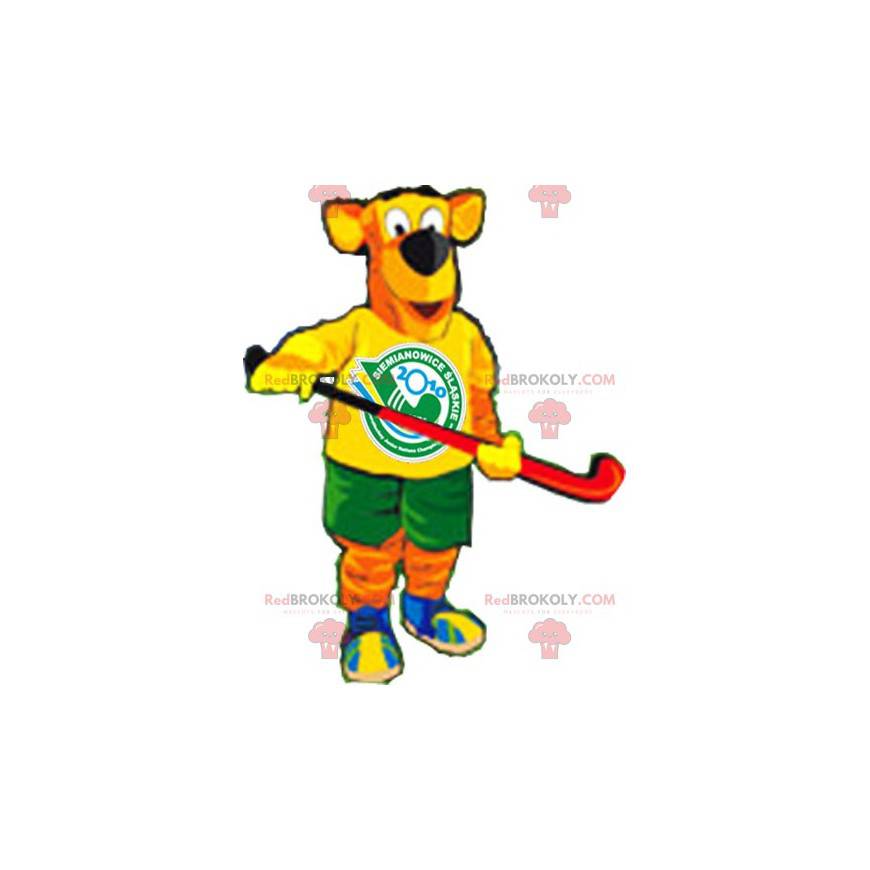 Mascote cão laranja e amarelo com equipamento de hóquei -