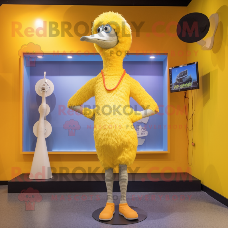 Yellow Ostrich mascot costume character dressed with a Swimwear and Beanies