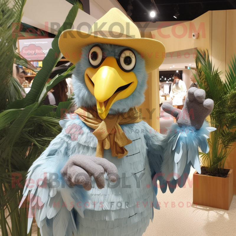 Yellow Harpy mascot costume character dressed with a Chambray Shirt and Hats Yellow Harpy mascot costume character dressed with a Chambray Shirt and Hats