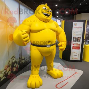 Yellow Strongman mascot costume character dressed with a Suit and Anklets