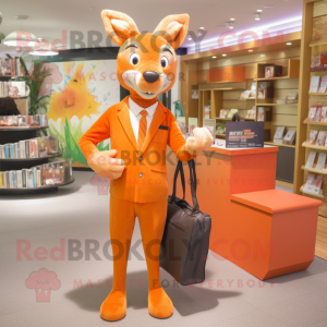 Orange Roe Deer mascot costume character dressed with a Suit and Clutch bags